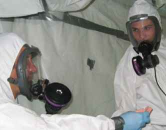 Two people in mold inspection suits
