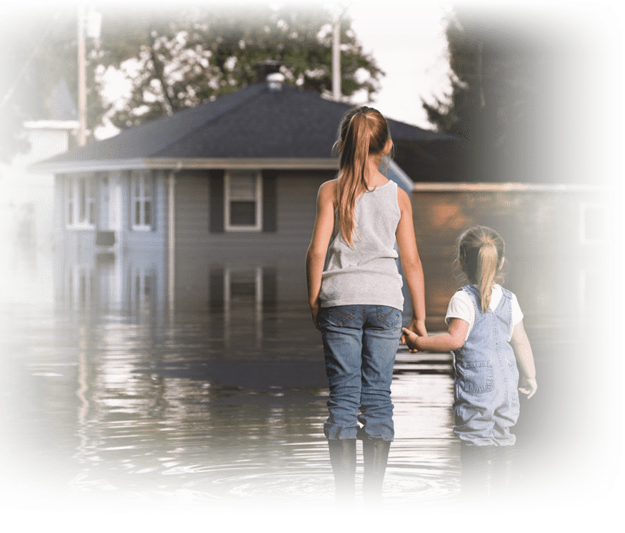 Family looking at flooded home.